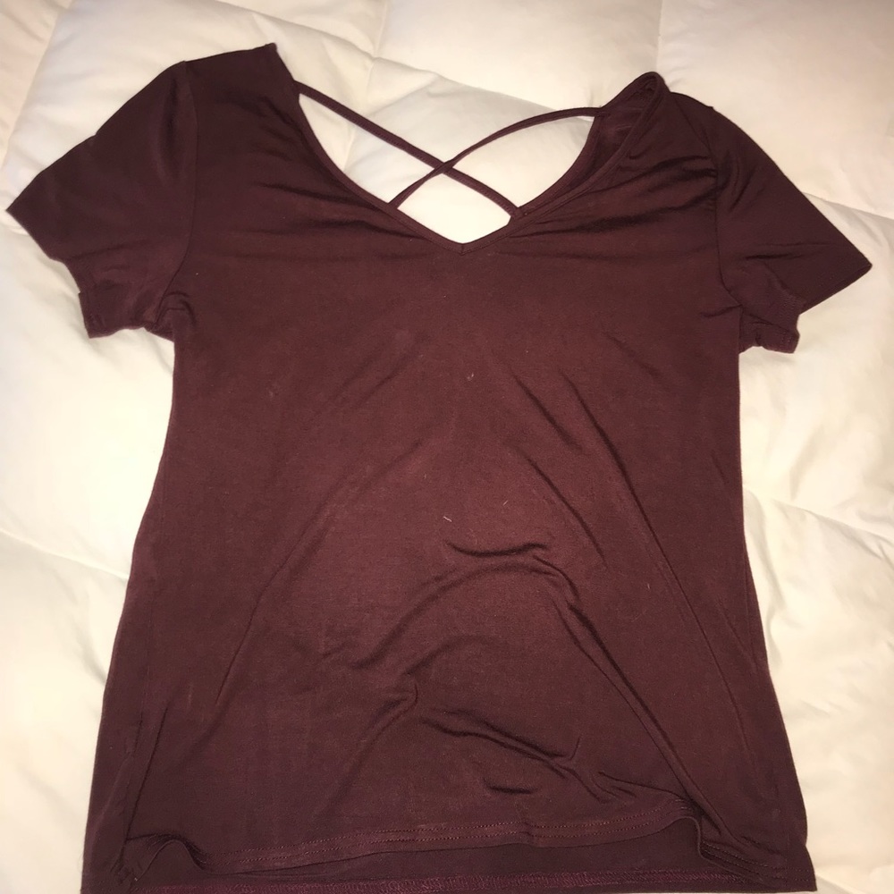 dark red shirt with criss cross in front